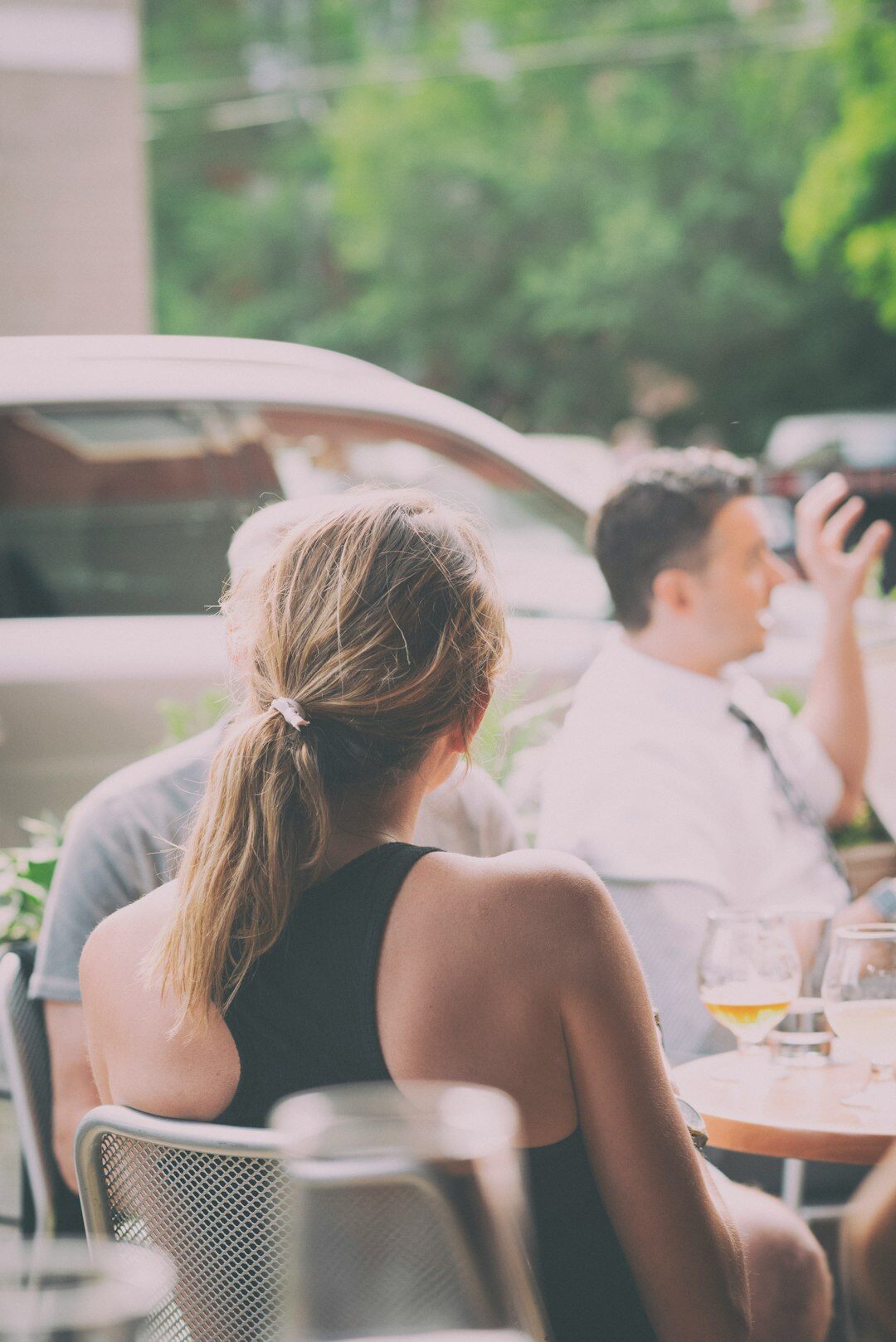 Small group of colleagues having an open conversation around a table