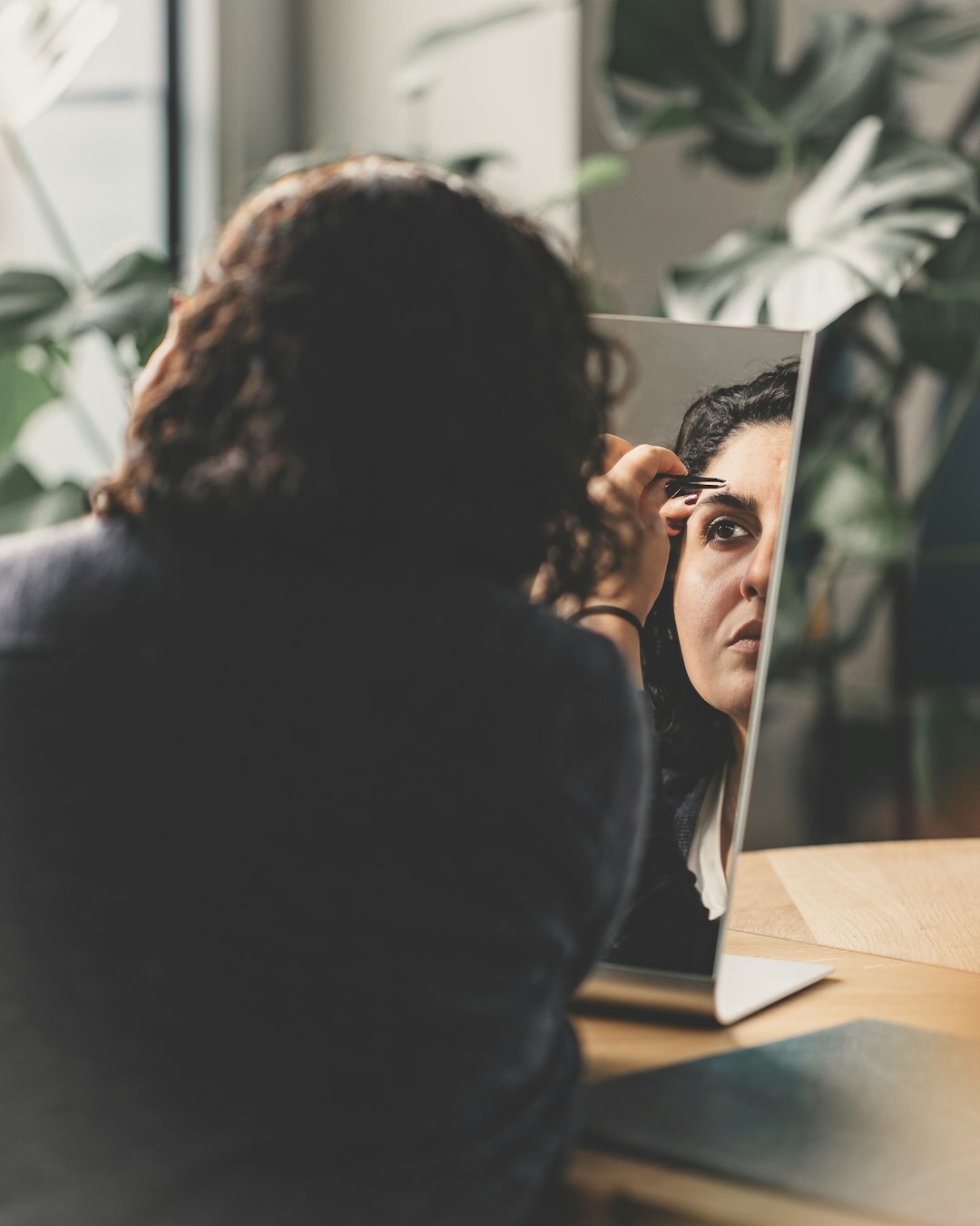 person practicing speech in mirror